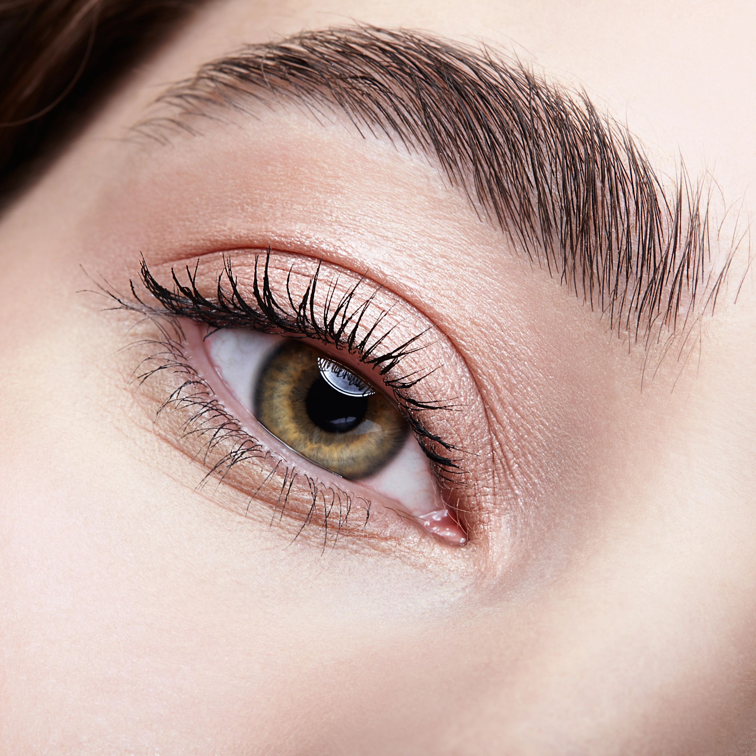 Brow detail close-up with soft makeup
