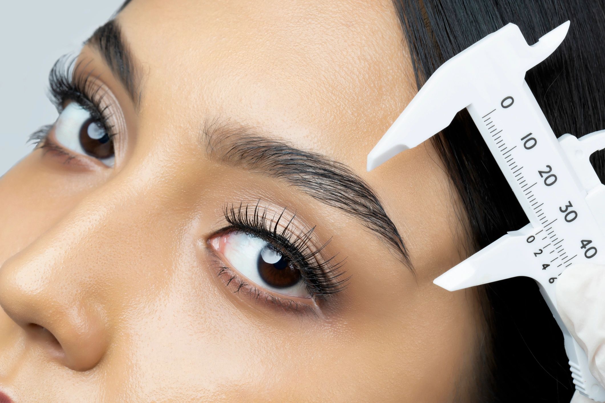 Close-up of eyebrow mapping and shaping